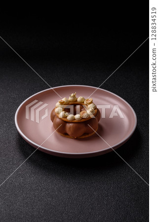 Round chocolate tart or pie with cream berry filling 128834519