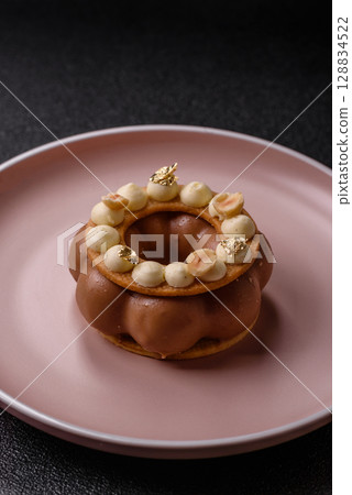 Round chocolate tart or pie with cream berry filling 128834522