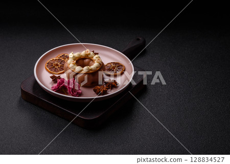 Round chocolate tart or pie with cream berry filling 128834527