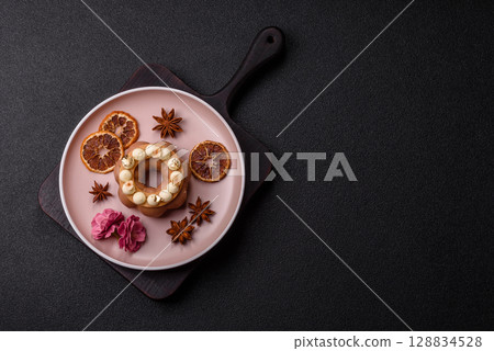 Round chocolate tart or pie with cream berry filling Round chocolate tart or pie with cream berry filling 128834528