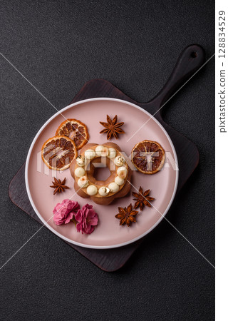 Round chocolate tart or pie with cream berry filling Round chocolate tart or pie with cream berry filling 128834529