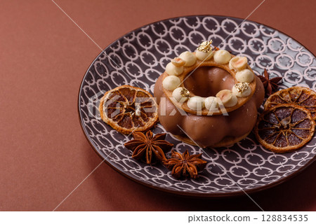 Round chocolate tart or pie with cream berry filling 128834535