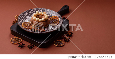 Round chocolate tart or pie with cream berry filling 128834543