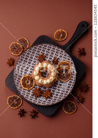 Round chocolate tart or pie with cream berry filling 128834545