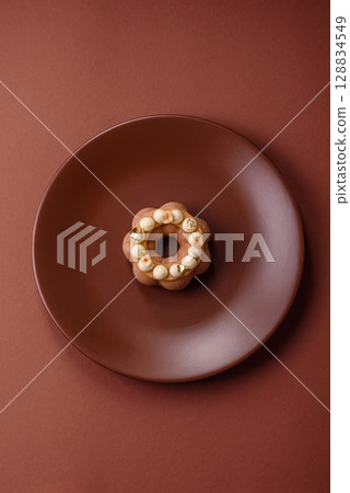 Round chocolate tart or pie with cream berry filling Round chocolate tart or pie with cream berry filling 128834549