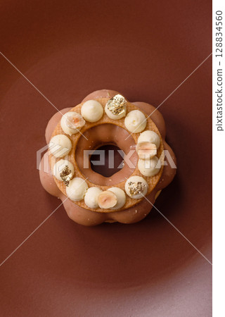 Round chocolate tart or pie with cream berry filling 128834560