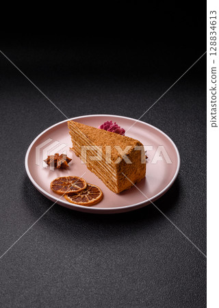 A slice of honey puff cake or pumpkin, carrot and cream pie, vegan sweets A slice of honey puff cake or pumpkin, carrot and cream pie, vegan sweets 128834613