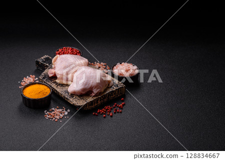 Chicken thigh raw, fresh poultry meat with salt and spices Chicken thigh raw, fresh poultry meat with salt and spices 128834667
