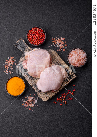 Chicken thigh raw, fresh poultry meat with salt and spices 128834671