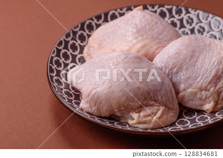 Chicken thigh raw, fresh poultry meat with salt and spices 128834681
