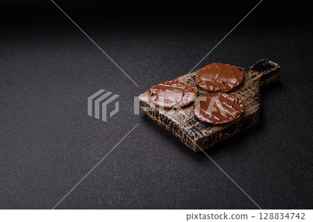 Matzah with chocolate paste for the Jewish holiday of passover 128834742