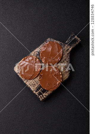 Matzah with chocolate paste for the Jewish holiday of passover 128834746