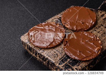 Matzah with chocolate paste for the Jewish holiday of passover Matzah with chocolate paste for the Jewish holiday of passover 128834749