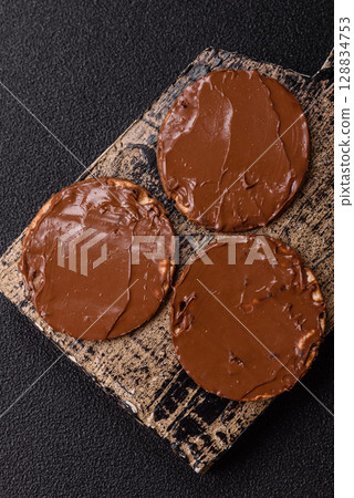 Matzah with chocolate paste for the Jewish holiday of passover 128834753