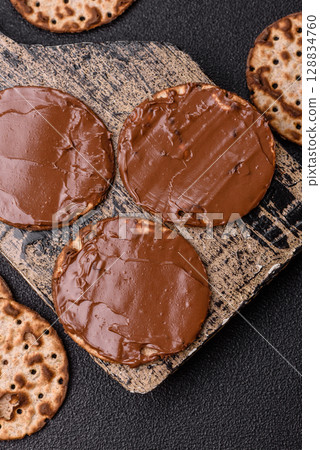 Matzah with chocolate paste for the Jewish holiday of passover 128834760
