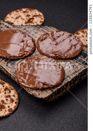 Matzah with chocolate paste for the Jewish holiday of passover 128834761