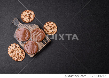 Matzah with chocolate paste for the Jewish holiday of passover Matzah with chocolate paste for the Jewish holiday of passover 128834763