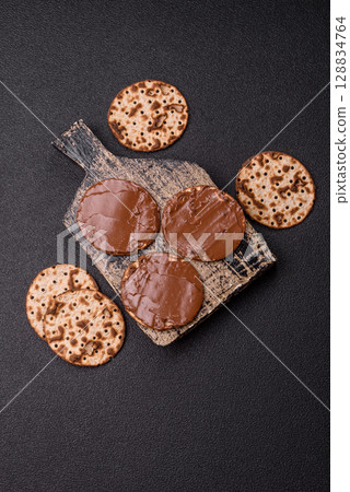 Matzah with chocolate paste for the Jewish holiday of passover 128834764