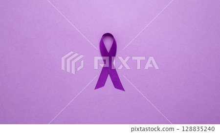 Purple ribbon held, symbol of support. Purple Epilepsy Awareness Day Purple ribbon held, symbol of support. Purple Epilepsy Awareness Day 128835240