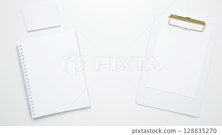 An empty mock up notebook and clipboard. On a white background, white and black cards An empty mock up notebook and clipboard. On a white background, white and black cards 128835270