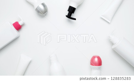 Skin care and beauty concept. Cosmetic beauty products. Bottles and tubes with branding mock up Skin care and beauty concept. Cosmetic beauty products. Bottles and tubes with branding mock up 128835283