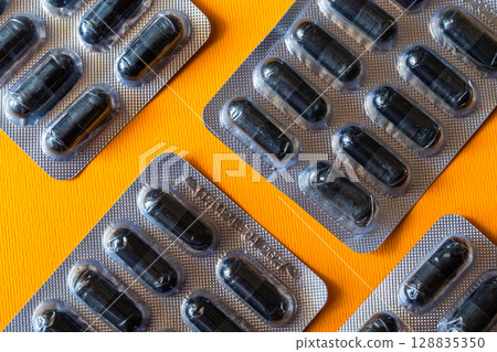 Lots of pills in a blister packs. Medical drug. Medicine. Medical background Lots of pills in a blister packs. Medical drug. Medicine. Medical background 128835350