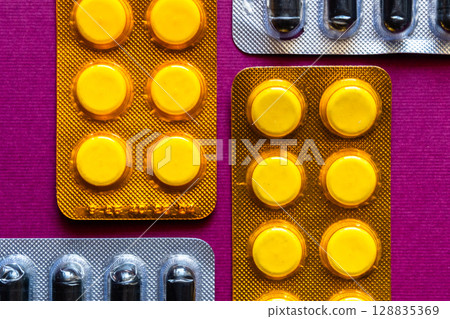 Lots of pills in a blister packs. Medical drug. Medicine. Medical background 128835369