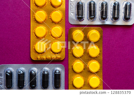 Lots of pills in a blister packs. Medical drug. Medicine. Medical background 128835370
