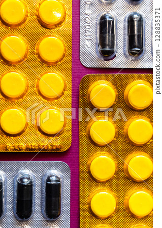 Lots of pills in a blister packs. Medical drug. Medicine. Medical background 128835371