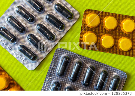 Lots of pills in a blister packs. Medical drug. Medicine. Medical background 128835373