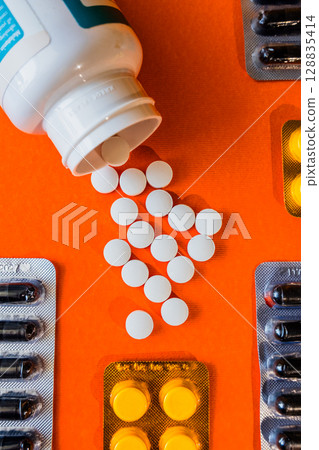 Lots of pills in a blister packs. Medical drug. Medicine. Medical background 128835414