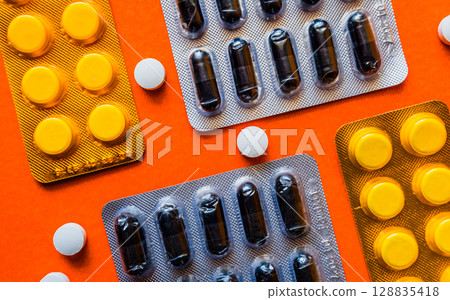 Lots of pills in a blister packs. Medical drug. Medicine. Medical background 128835418