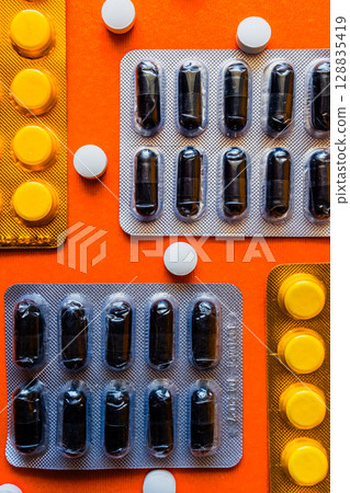 Lots of pills in a blister packs. Medical drug. Medicine. Medical background 128835419