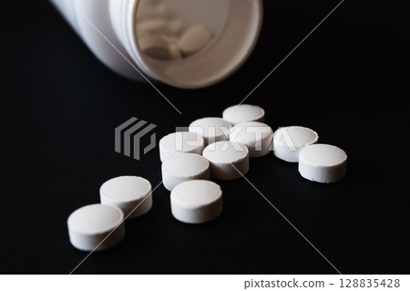 Lots of pills in a blister packs. Medical drug. Medicine. Medical background Lots of pills in a blister packs. Medical drug. Medicine. Medical background 128835428