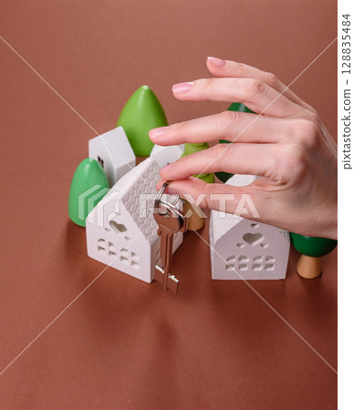Home, house, buying property for business or life. Concept with human hand Home, house, buying property for business or life. Concept with human hand 128835484