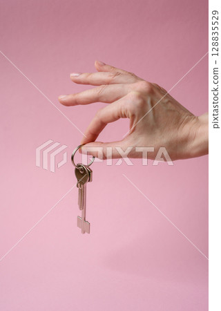 Home, house, buying property for business or life. Concept with human hand Home, house, buying property for business or life. Concept with human hand 128835529