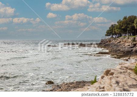Mediterranean coastal landscape with rocky cliffs and pier. Istria, Croatia. 128835772
