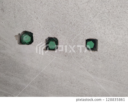 Green Pipe Installed in Bathroom Tile Hole Made with Cutter Machine for Fitting Accessories Setup Green Pipe Installed in Bathroom Tile Hole Made with Cutter Machine for Fitting Accessories Setup 128835861