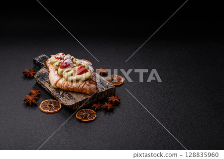 Food for breakfast sweet strawberry croissants with chocolate filling Food for breakfast sweet strawberry croissants with chocolate filling 128835960
