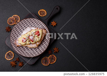 Food for breakfast sweet strawberry croissants with chocolate filling Food for breakfast sweet strawberry croissants with chocolate filling 128835975