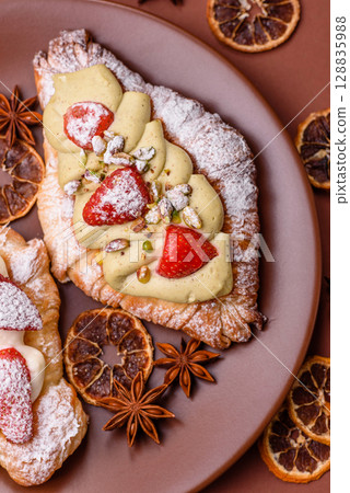 Food for breakfast sweet strawberry croissants with chocolate filling Food for breakfast sweet strawberry croissants with chocolate filling 128835988