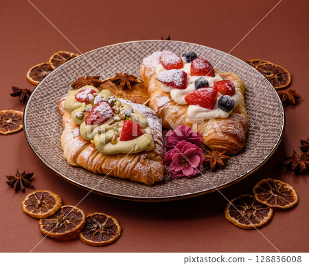 Food for breakfast sweet strawberry croissants with chocolate filling Food for breakfast sweet strawberry croissants with chocolate filling 128836008