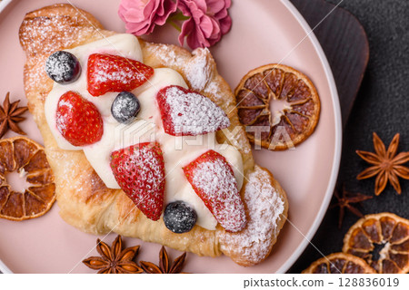 Food for breakfast sweet strawberry croissants with chocolate filling Food for breakfast sweet strawberry croissants with chocolate filling 128836019