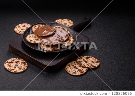 Matzah with chocolate paste for the Jewish holiday of passover 128836056