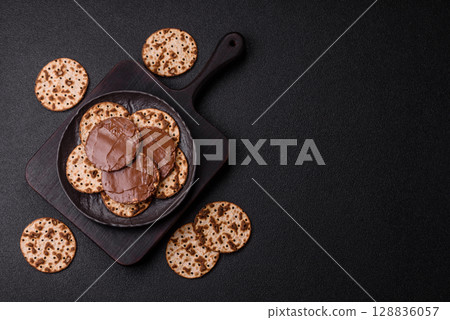 Matzah with chocolate paste for the Jewish holiday of passover 128836057