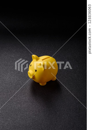 Piggy bank as a financial conceptual background with coins, doing business, saving money 128836063