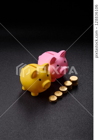 Piggy bank as a financial conceptual background with coins, doing business, saving money 128836106
