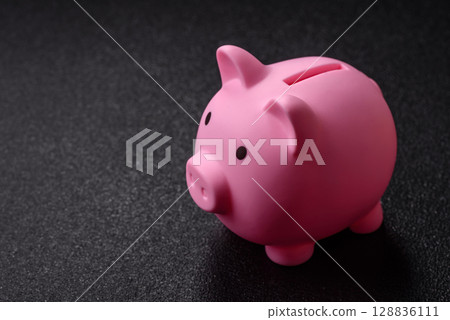 Piggy bank as a financial conceptual background with coins, doing business, saving money 128836111