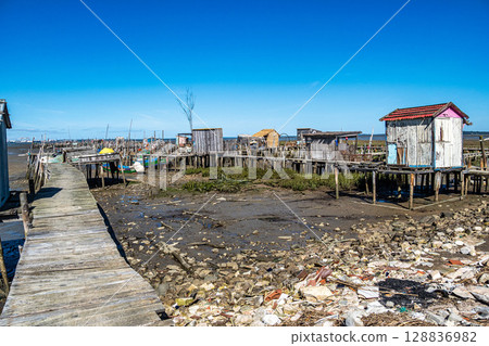 Traditional fishermen wooden jetties Cais Palafitico on Carrasqueira, Alcacer do Sal, Setubal, Portugal 128836982