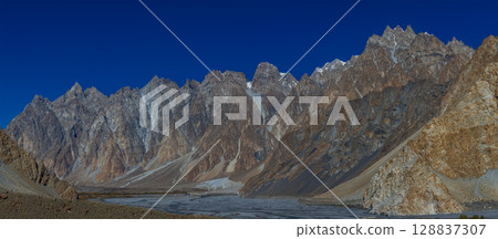 The autumn scenery with Tupopdan, Passu Cathedral or Passu Cones, is a mountain in northern Pakistan The autumn scenery with Tupopdan, Passu Cathedral or Passu Cones, is a mountain in northern Pakistan 128837307